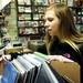 Pittsburg resident Rebekah Harris thumbs through music on the front counter at Wazoo Records during Record Store Day on Saturday, April 20. AnnArbor.com I Daniel Brenner